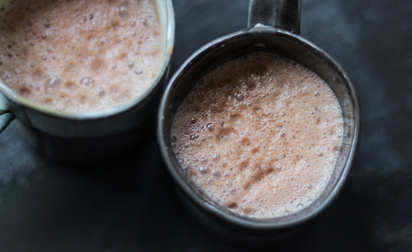 Raspberry hot cocoa made in a Vitamix