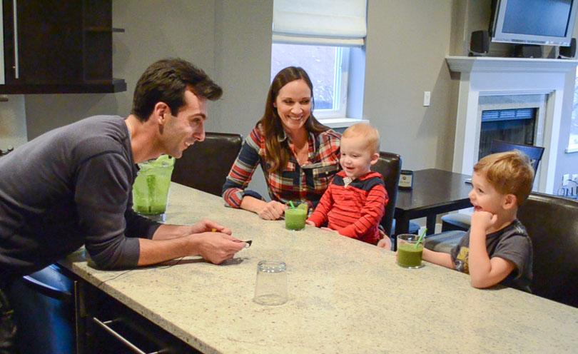 Lenny Gale serving his neighbors' kids vegetables via a green smoothie.