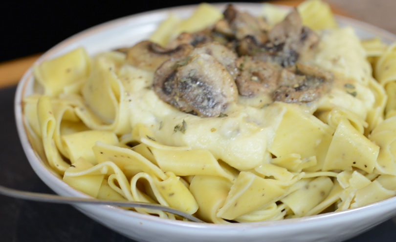 Vegan alfredo sauce served over pasta.