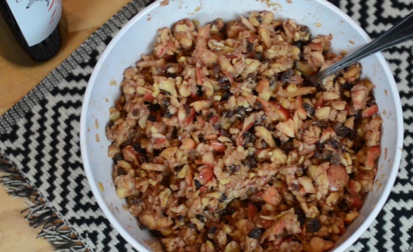 Overhead view of charoset served in giant white bowl.