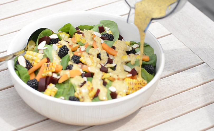 Apricot poppy seed vinaigrette served over springtime salad.