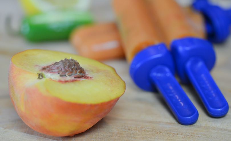 Peach jalapeño popsicles served.