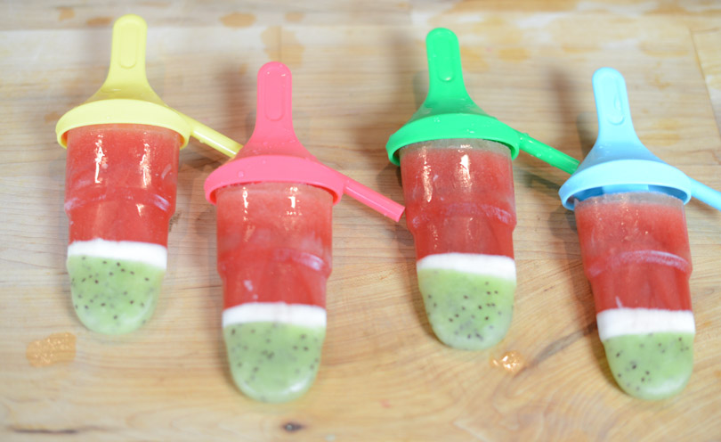 Watermelon kiwi coconut popsicles served.