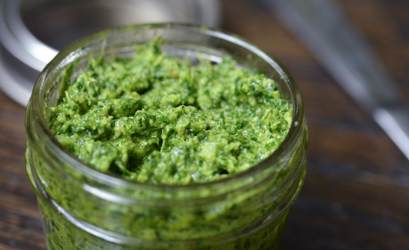 Jar full of pesto.