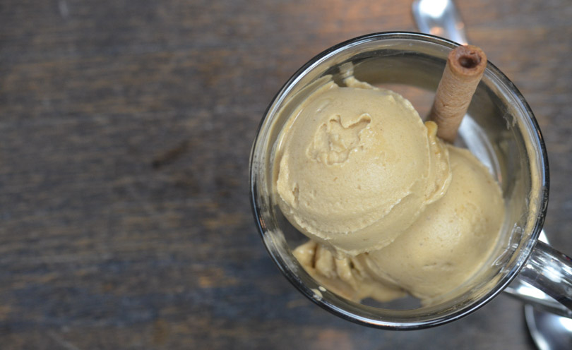 Coffee ice cream made in a Vitamix served in a glass mug.