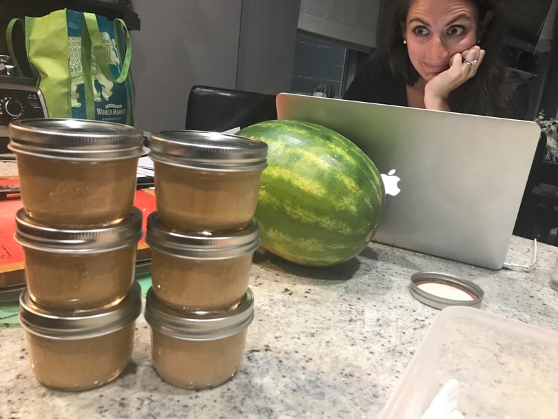 Shalva looking at jars of Life is NOYOKE's queso.