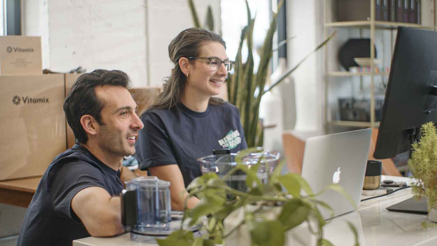 Shalva and Lenny Gale of Blending For Good working at a desk